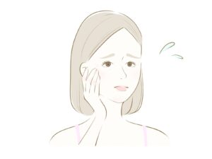 目元のシワやクマの根本的な原因を特定し、乾燥や眼精疲労との深い関係に基づいた適切なケアや治療法を決定するために、医師による診察や相談を受けている女性の様子
